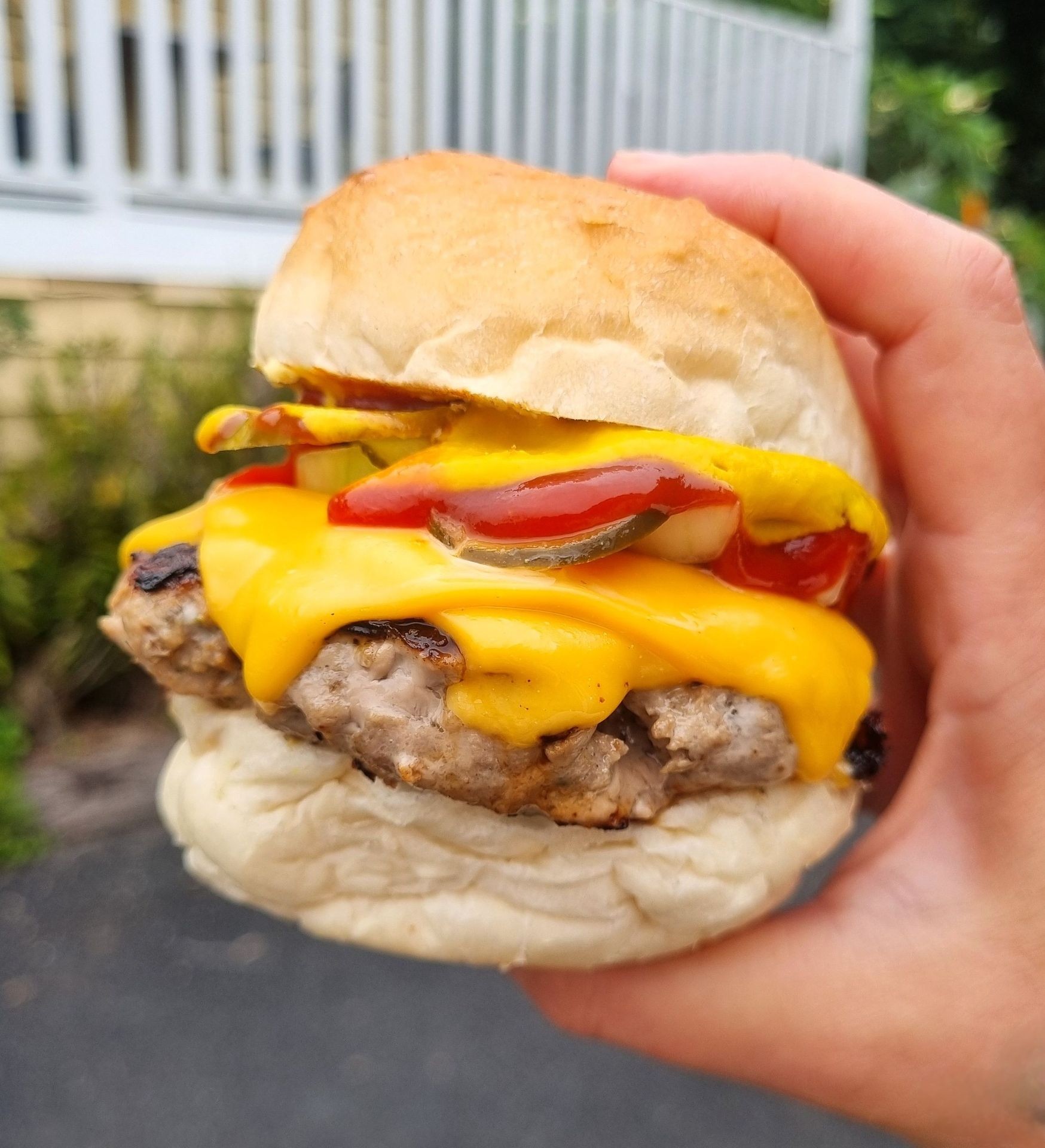 Juicy cheeseburger with fresh toppings at Mother Tucker Tilba