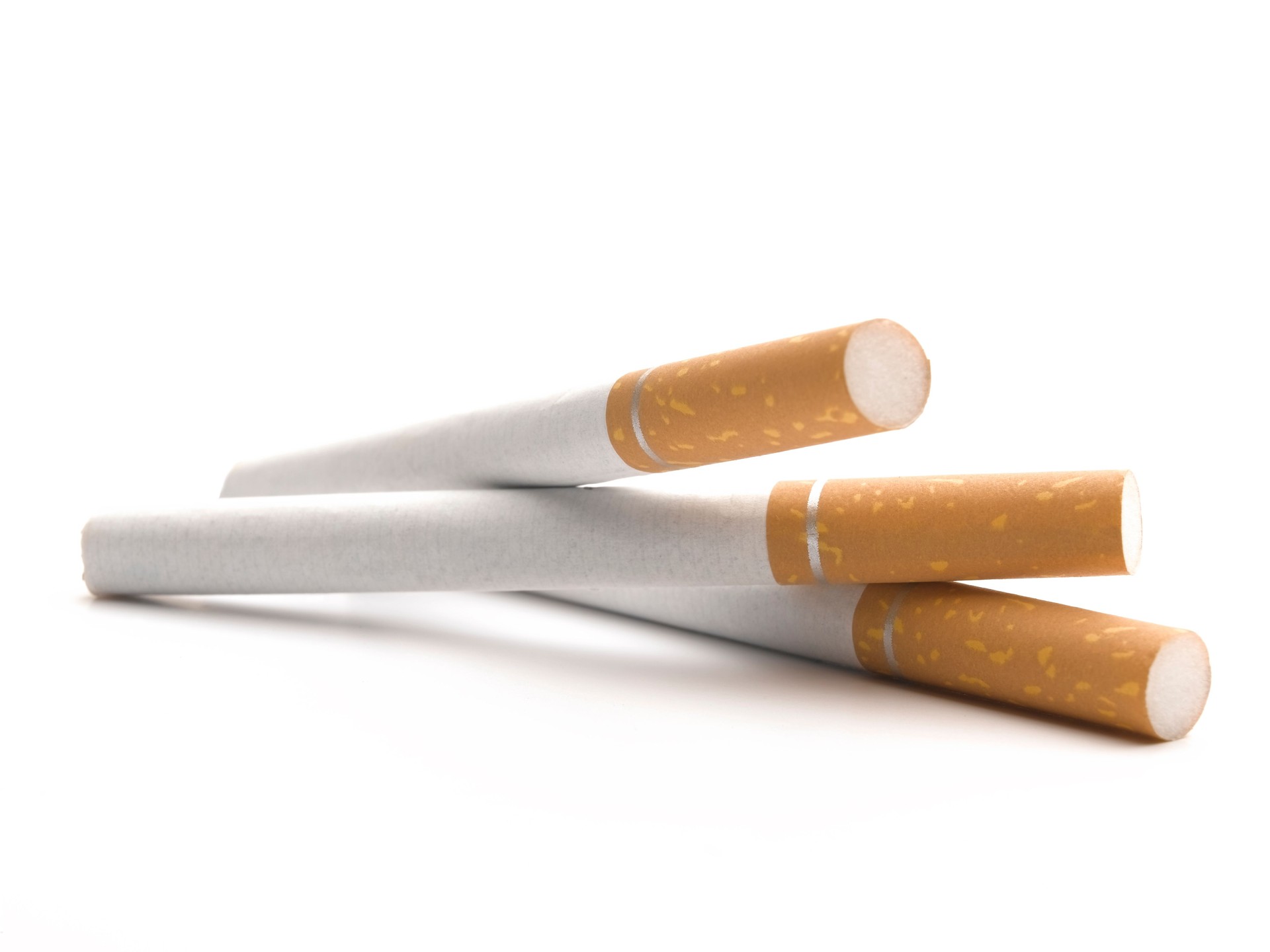 Three cigarettes on a white background